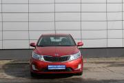 Красный Kia Rio 6-speed 1.6 MT (123 л.с.) 2014 фото 1