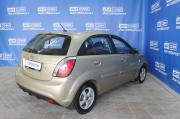 бежевый Kia Rio 1.4 AT (97 л.с.) 2010 фото 9