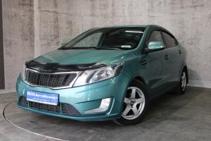 Зеленый Kia Rio, III 5-speed 1.6 MT (123 л.с.) 2014