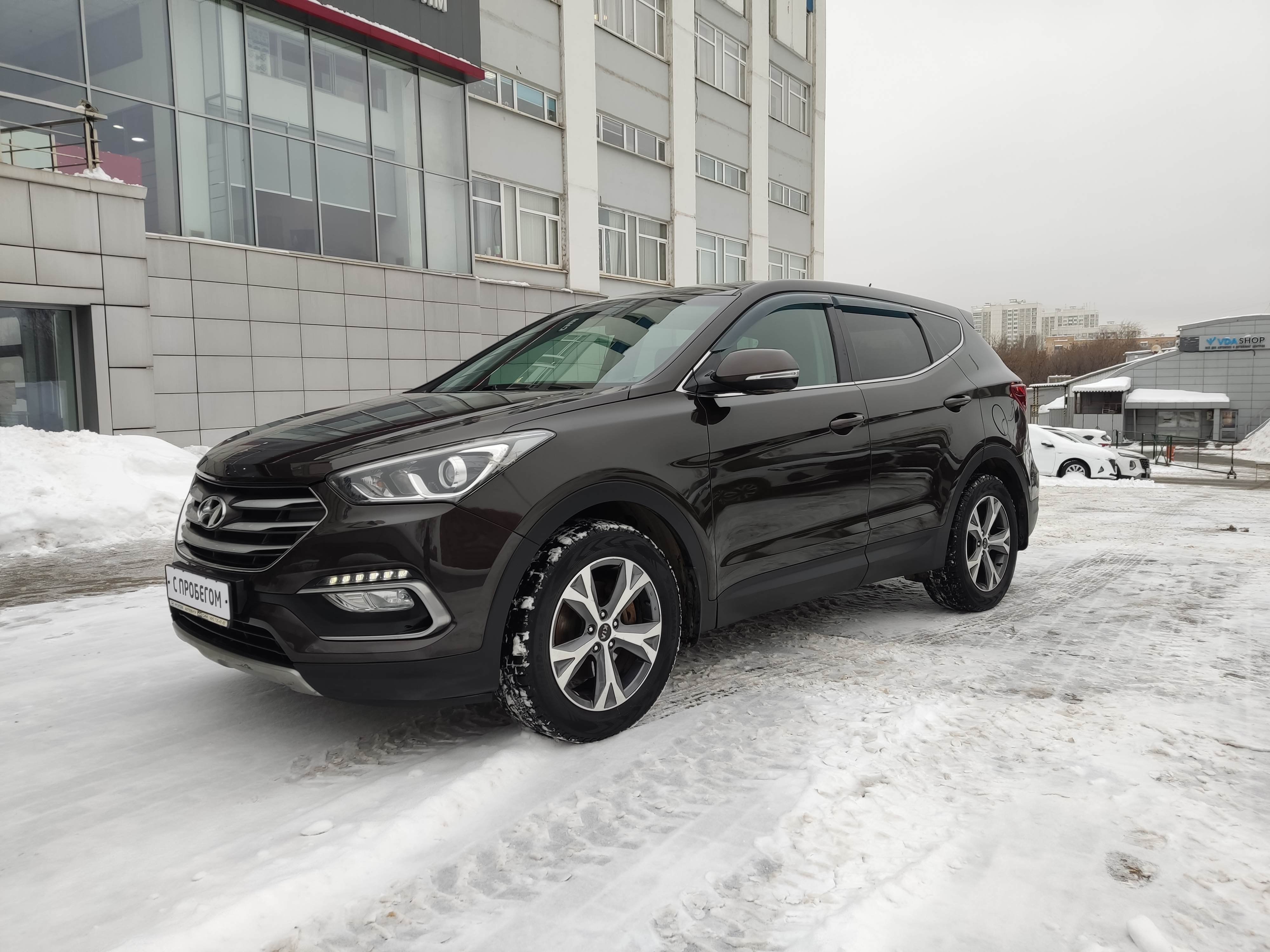 коричневый Hyundai Santa Fe 2.2d AT (200 л.с.) 4WD 2016