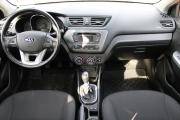 Красный Kia Rio 6-speed 1.6 MT (123 л.с.) 2014 фото 8