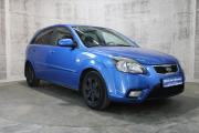 Синий Kia Rio 1.4 MT (97 л.с.) 2010 фото 2