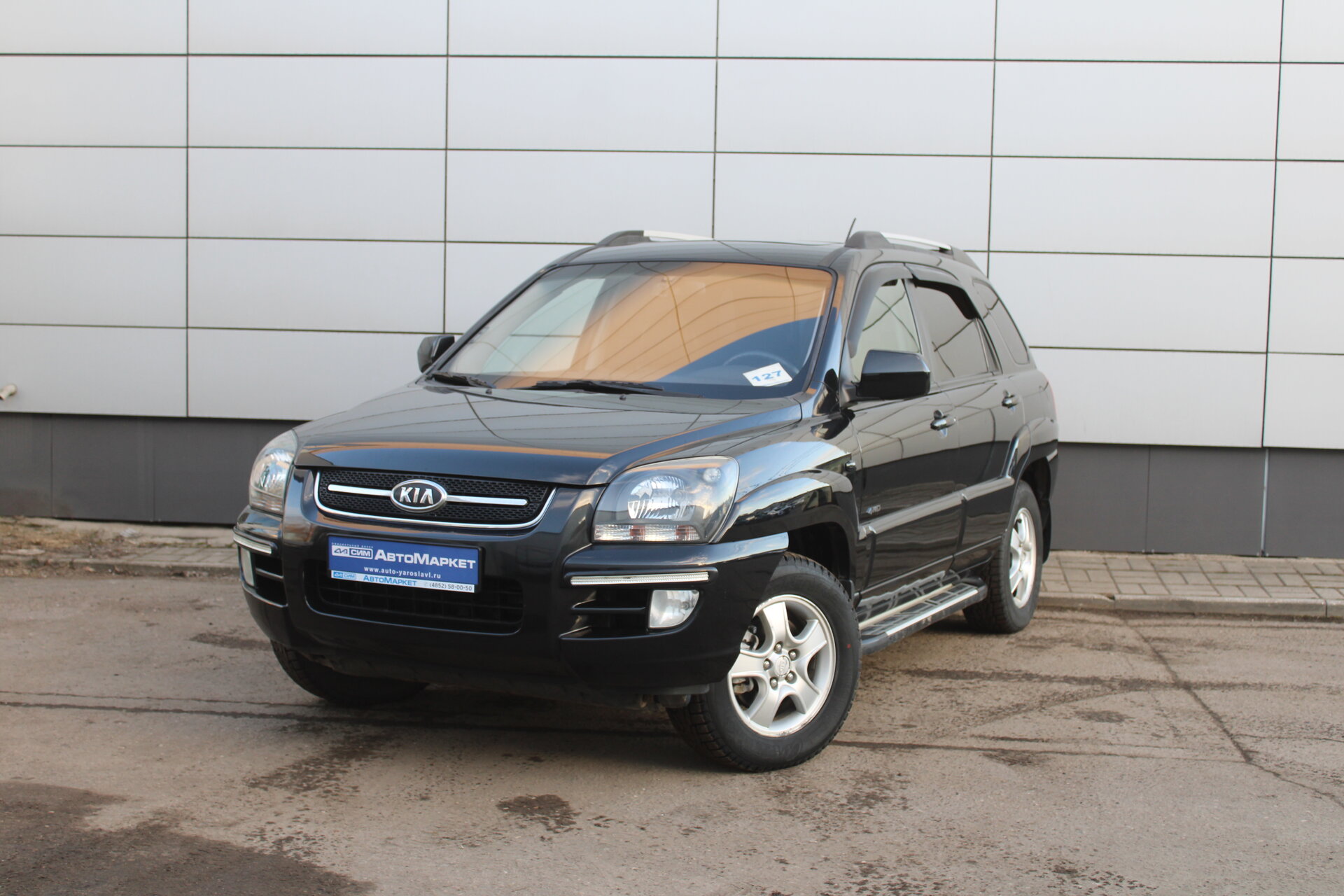 Черный Kia Sportage, II 2.0 AT (141 л.с.) 4WD 2008