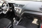 Красный Kia Rio 6-speed 1.6 MT (123 л.с.) 2014 фото 10